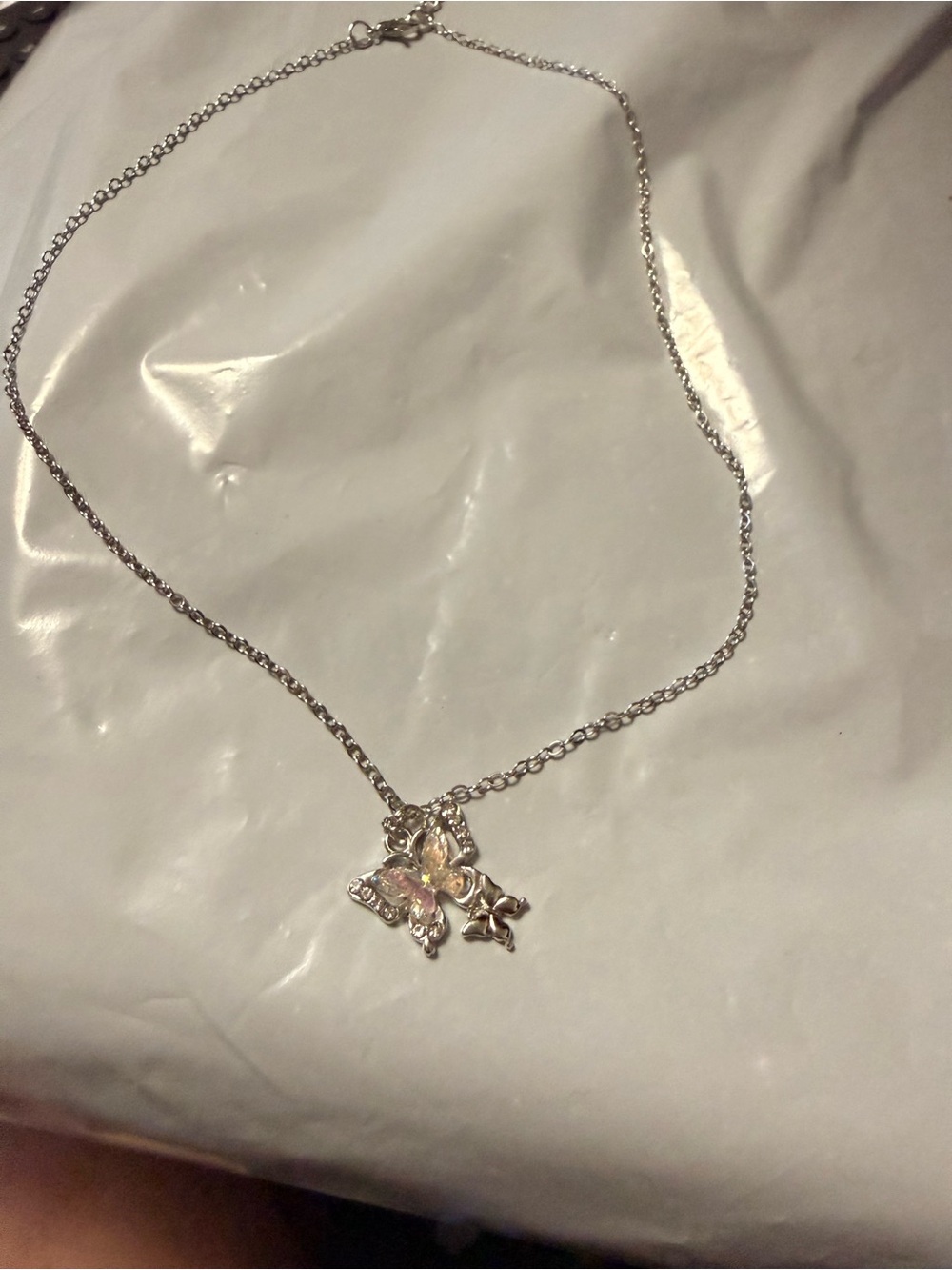 Delicate Silver Butterfly Pendant Necklace with Pink Accent